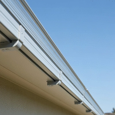 Gutter guards installed on a residential gutter, clean and preventing debris accumulation